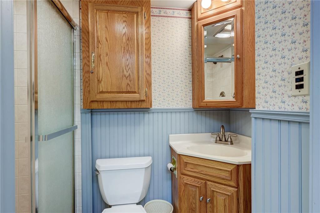 139 La Ray Drive Butler, PA 16001 - Photo 11 of 31 a bathroom with a toilet a sink and mirror