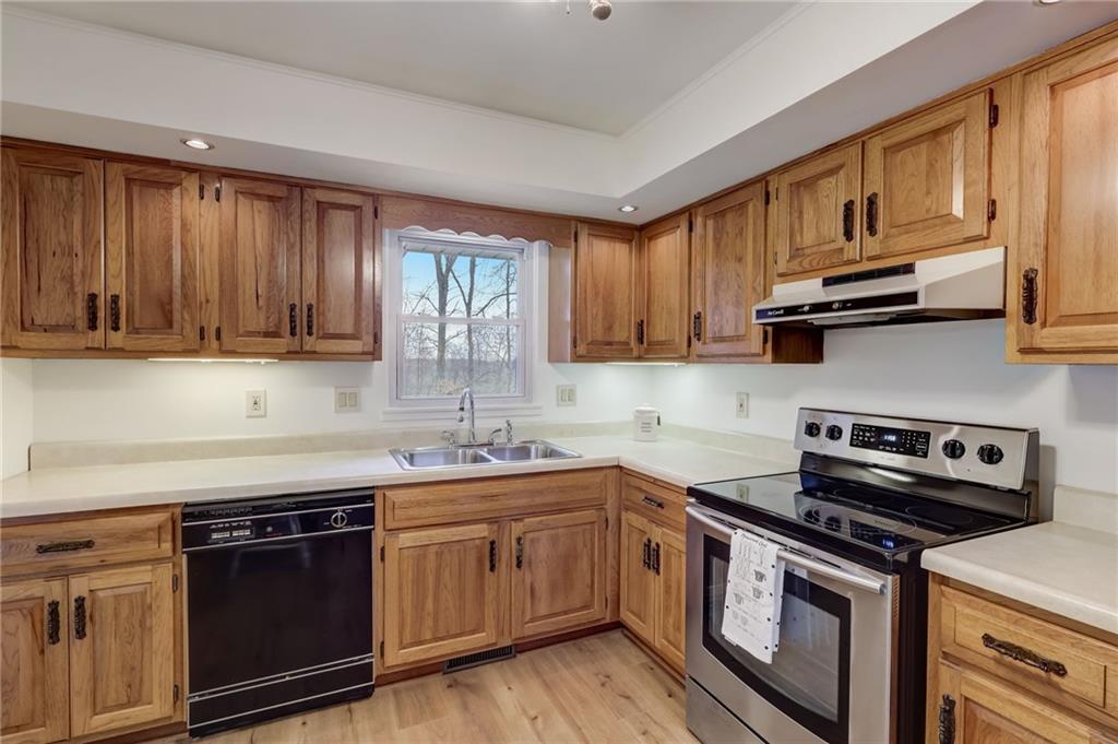 139 La Ray Drive Butler, PA 16001 - Photo 15 of 31 a kitchen with stainless steel appliances granite countertop a sink a stove a microwave and cabinets