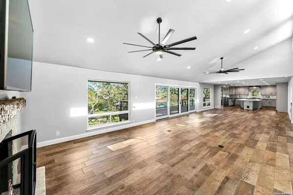 a kitchen with stainless steel appliances granite countertop a stove and a white cabinets