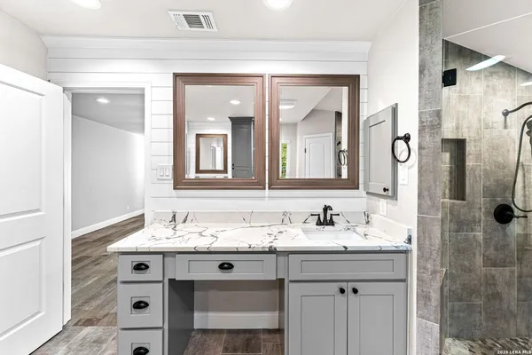 a view of balcony with wooden floor