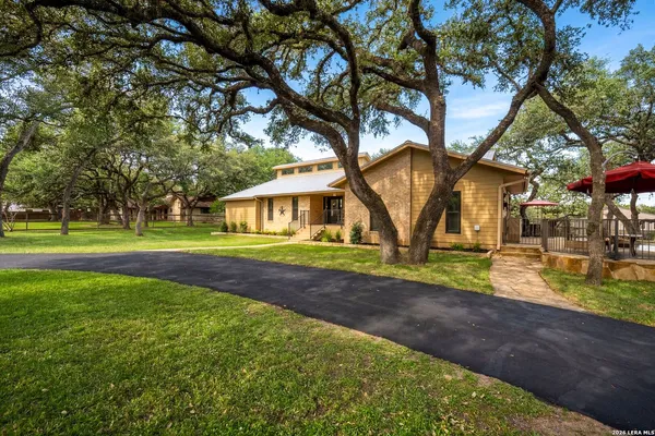 a living room with lots of furniture and a flat screen tv