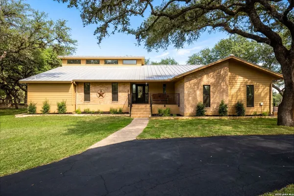 a view of a room with furniture and a ceiling fan