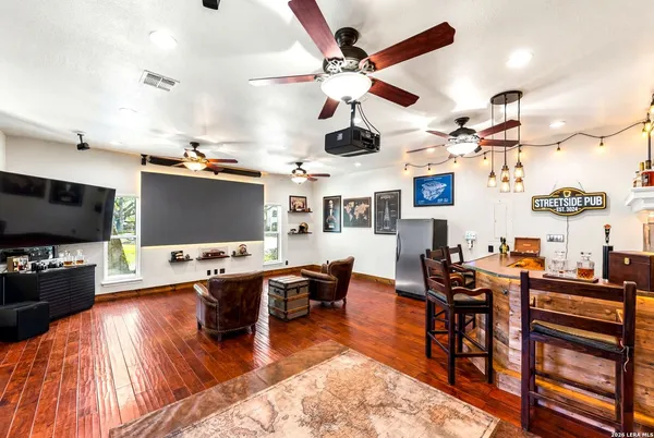 a view of a livingroom with furniture and a flat screen tv