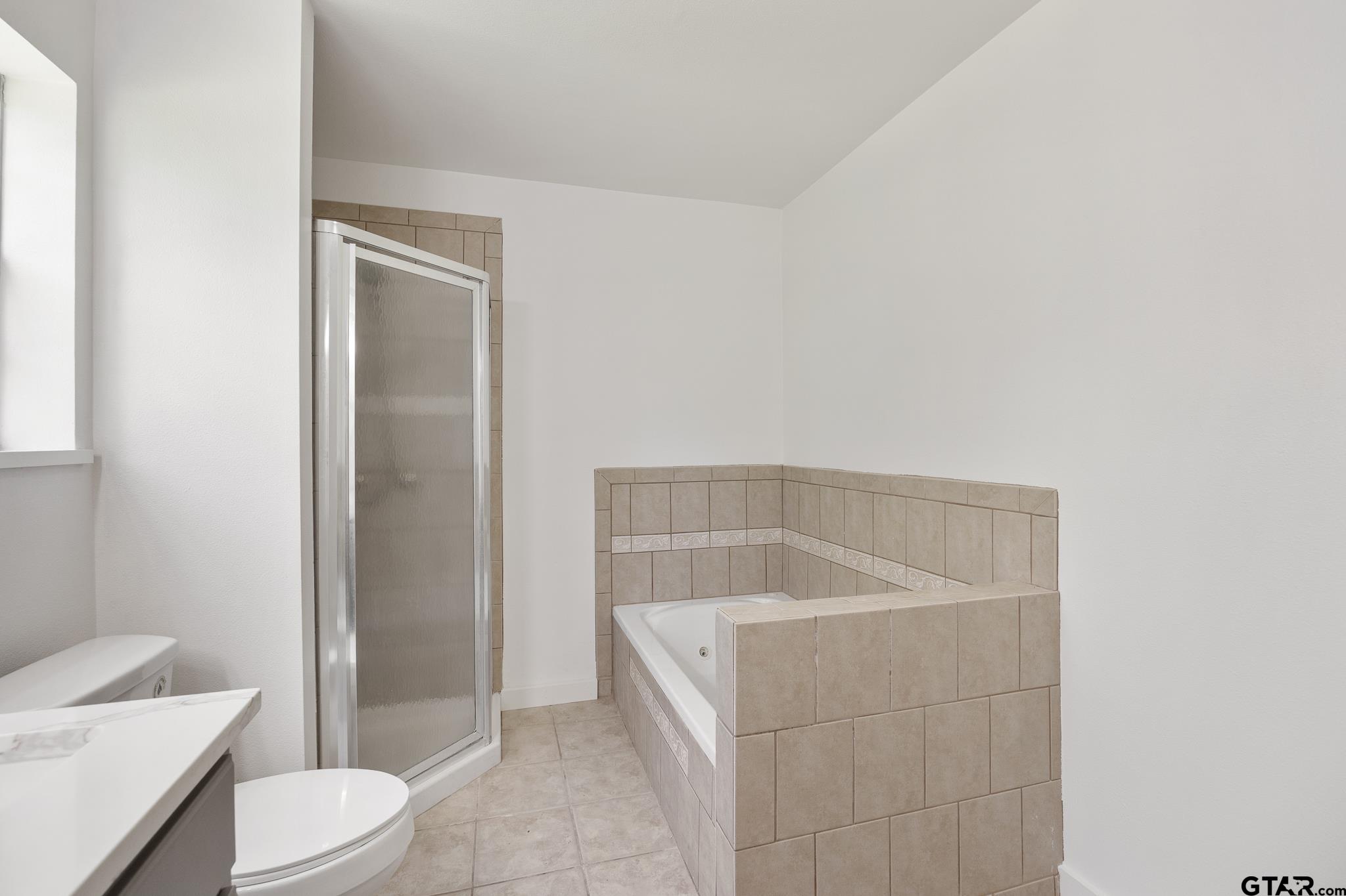 1538 North Hill Road Tyler, TX 75702 - Photo 27 of 29 a bathroom with a sink a toilet and shower