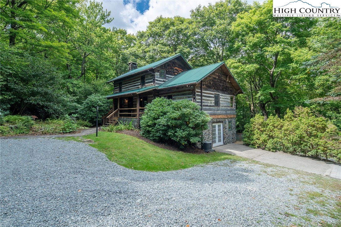 142 Teaberry Path Boone, NC 28607 - Photo 1 of 19 a house with a tree in front of it