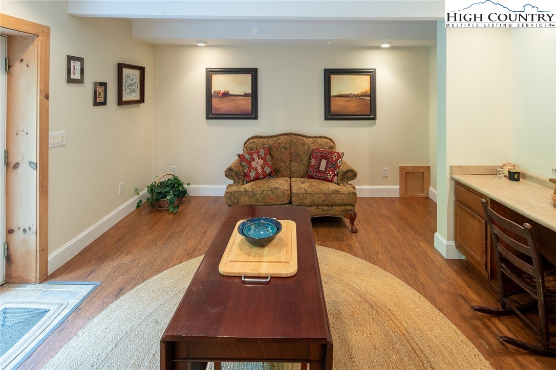 142 Teaberry Path Boone, NC 28607 - Photo 15 of 19 a living room with furniture and a wooden floor