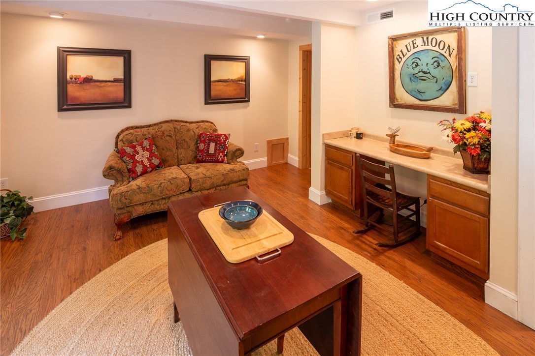 142 Teaberry Path Boone, NC 28607 - Photo 16 of 19 a living room with furniture and a mirror