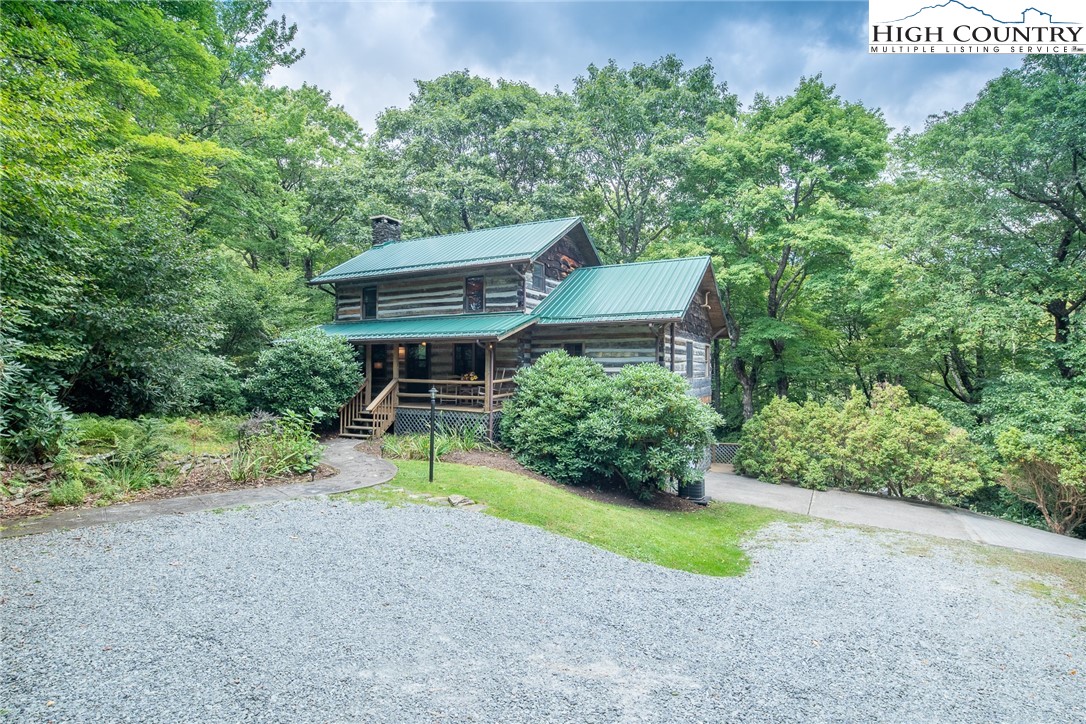 142 Teaberry Path Boone, NC 28607 - Photo 2 of 19 a view of a house with a yard and sitting area