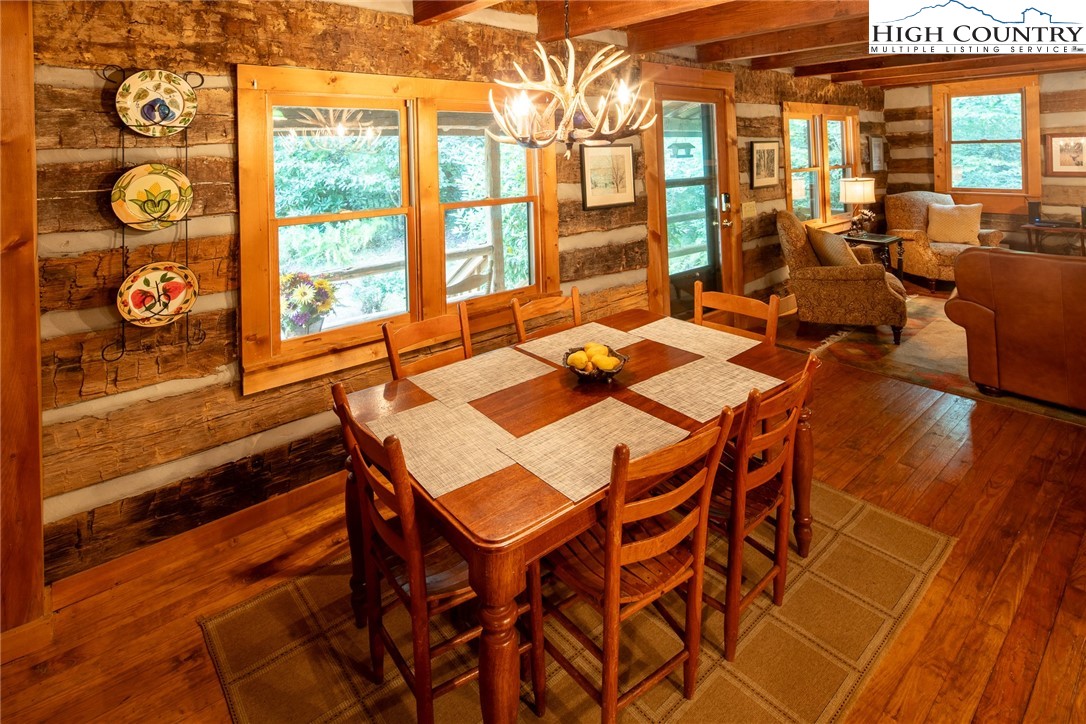 142 Teaberry Path Boone, NC 28607 - Photo 8 of 19 a dining room with furniture and wooden floor