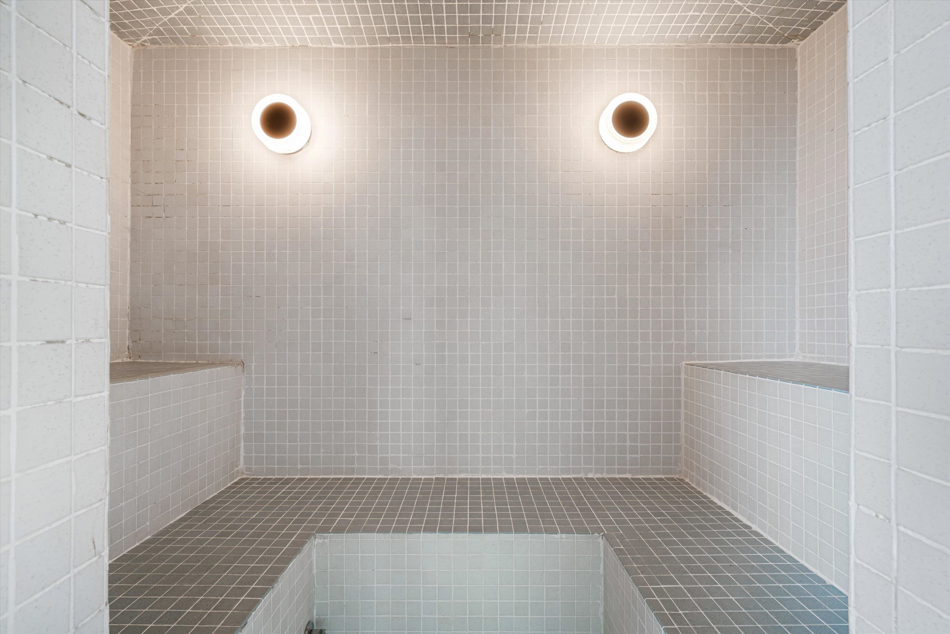 200 Wagner Street, Unit 604 Memphis, TN 38103 - Photo 30 of 36 Full bath featuring a sauna, a tile shower, and tile walls