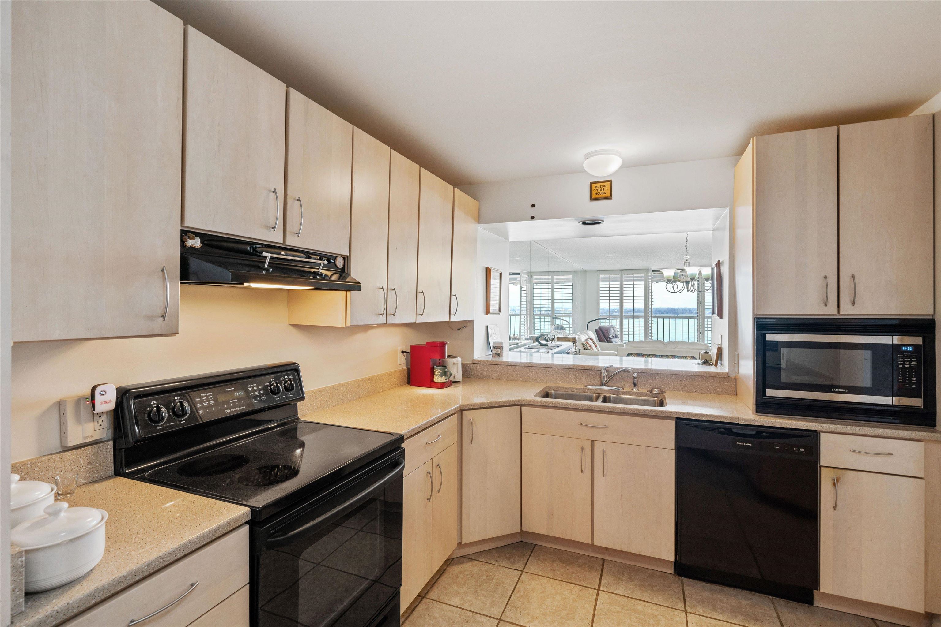 200 Wagner Street, Unit 604 Memphis, TN 38103 - Photo 10 of 36 a kitchen with a sink stove top oven and refrigerator