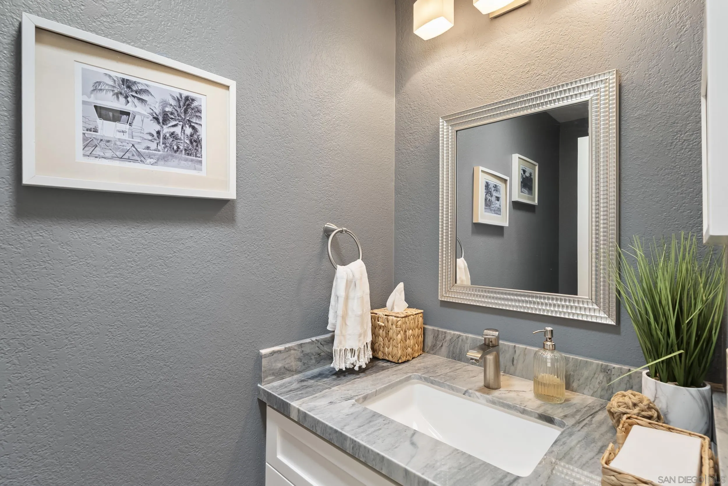 489 La Costa Avenue Encinitas, CA 92024 - Photo 13 of 45 a bathroom with a granite countertop sink and a mirror