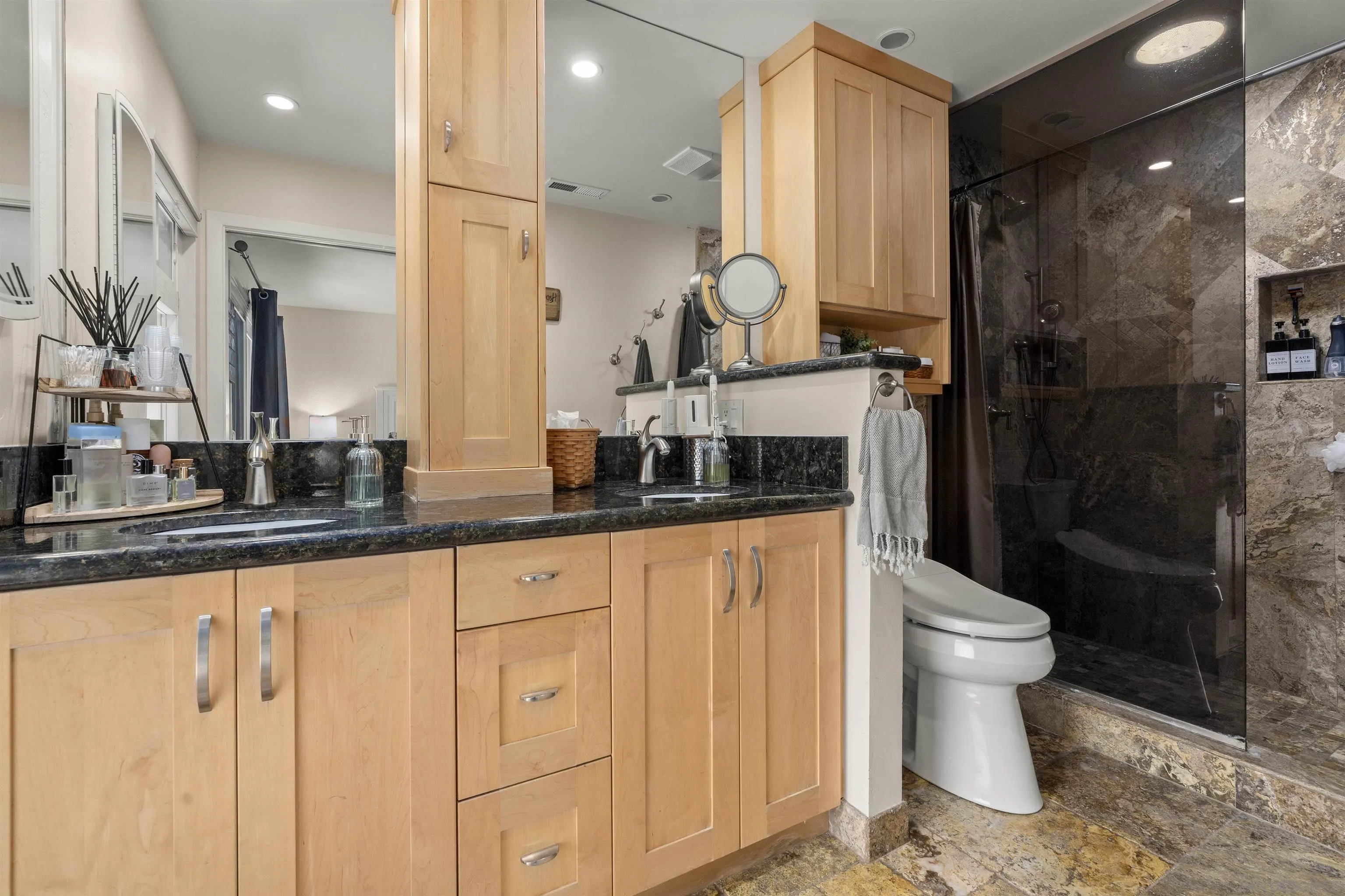 489 La Costa Avenue Encinitas, CA 92024 - Photo 20 of 45 a bathroom with a sink a toilet and a mirror