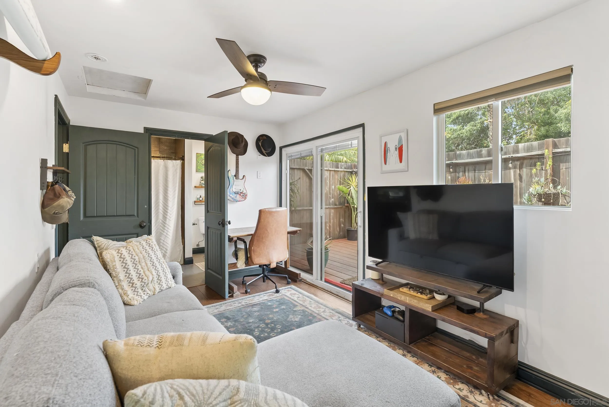 489 La Costa Avenue Encinitas, CA 92024 - Photo 22 of 45 a living room with furniture and a flat screen tv