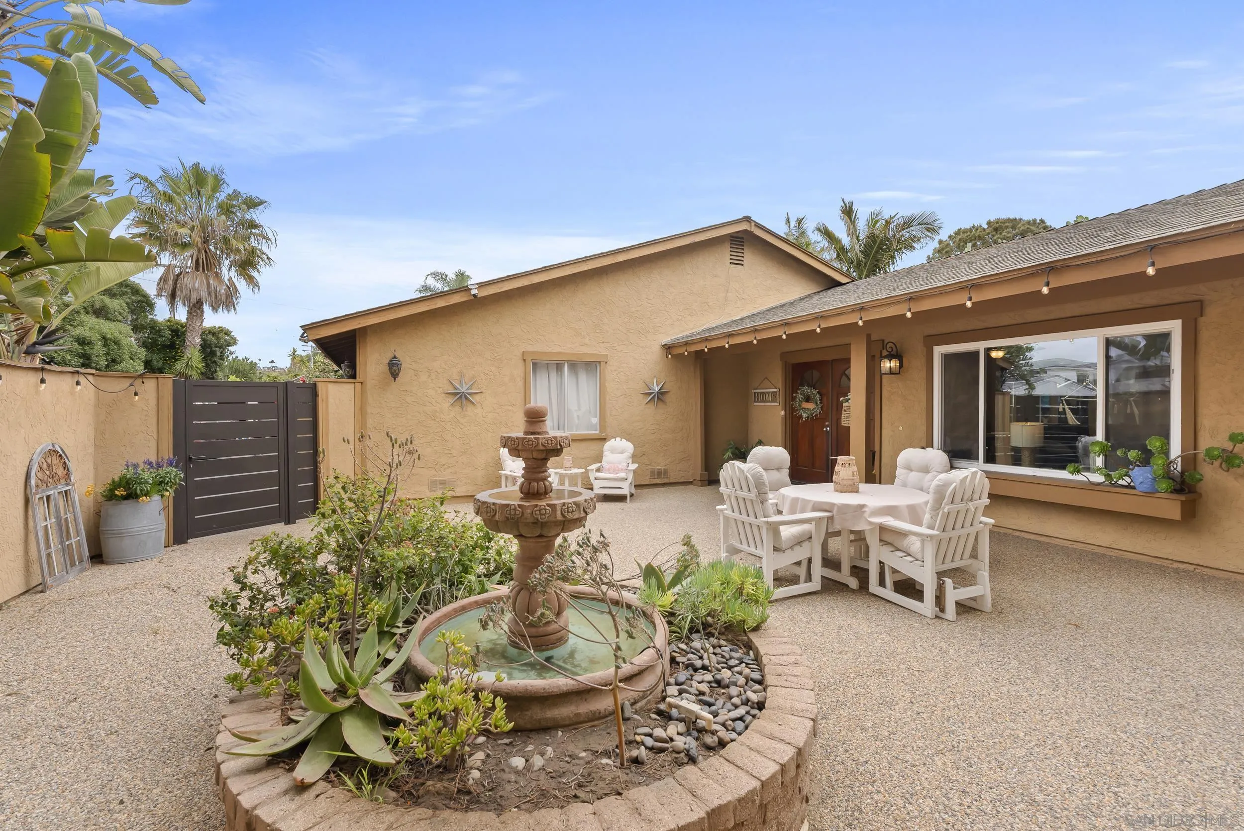 489 La Costa Avenue Encinitas, CA 92024 - Photo 3 of 45 a view of a patio with table and chairs and potted plants