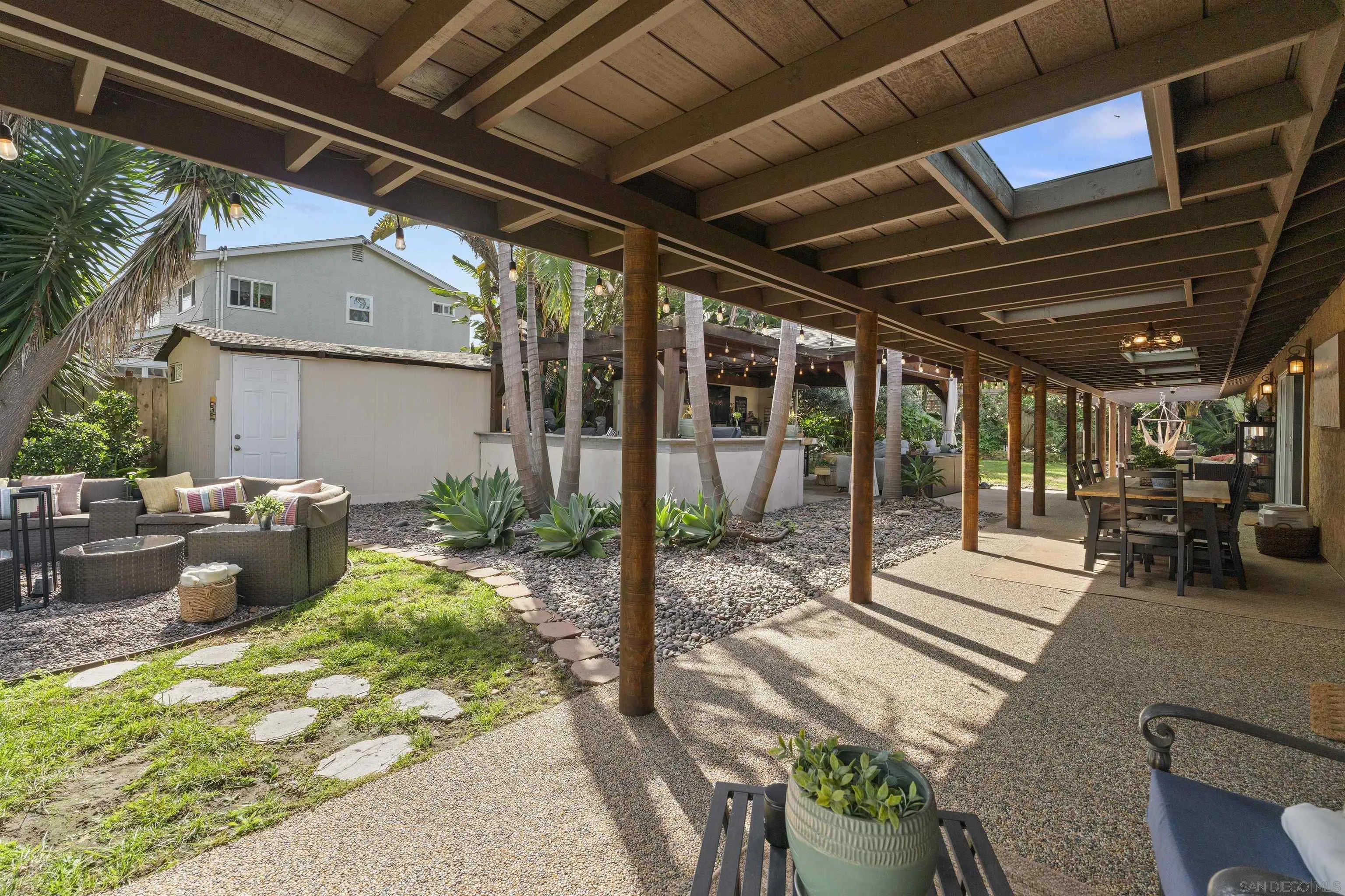 489 La Costa Avenue Encinitas, CA 92024 - Photo 31 of 45 a view of a porch with furniture and a yard