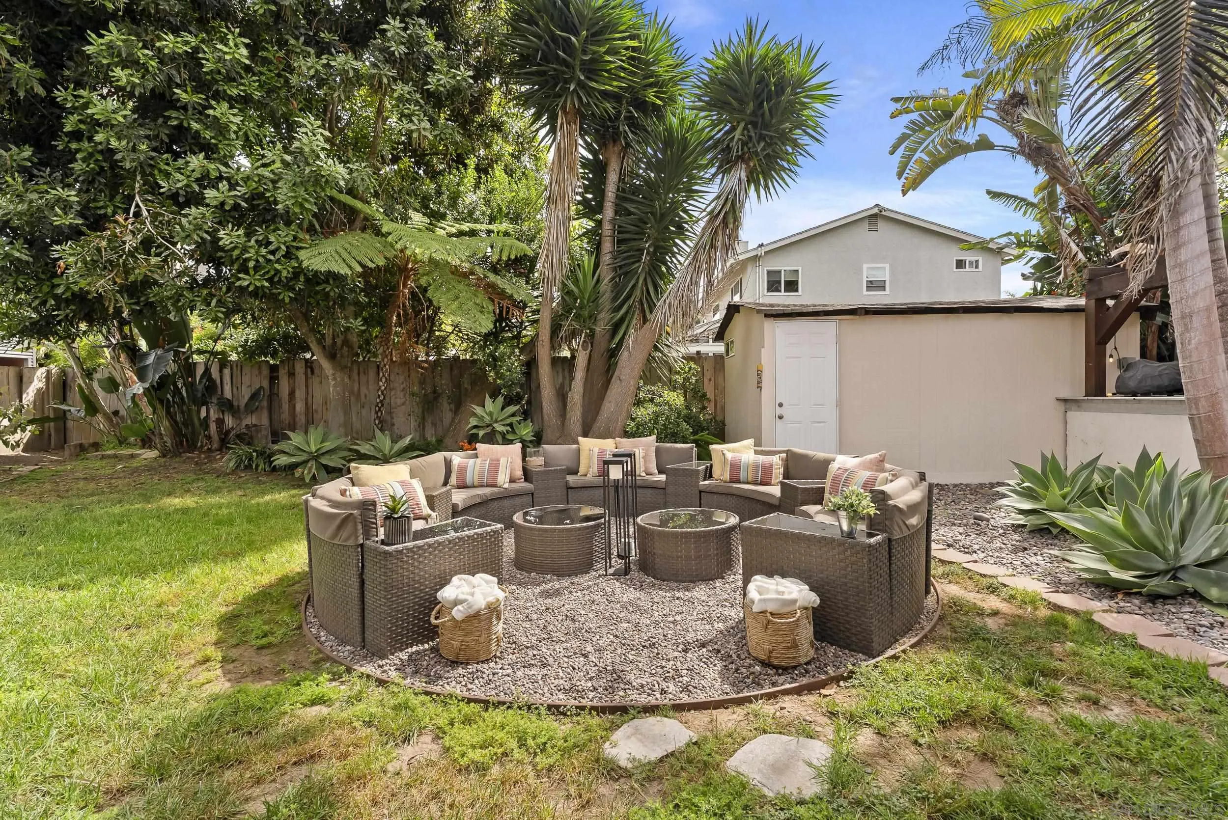 489 La Costa Avenue Encinitas, CA 92024 - Photo 39 of 45 a view of a backyard with fountain plants and large tree