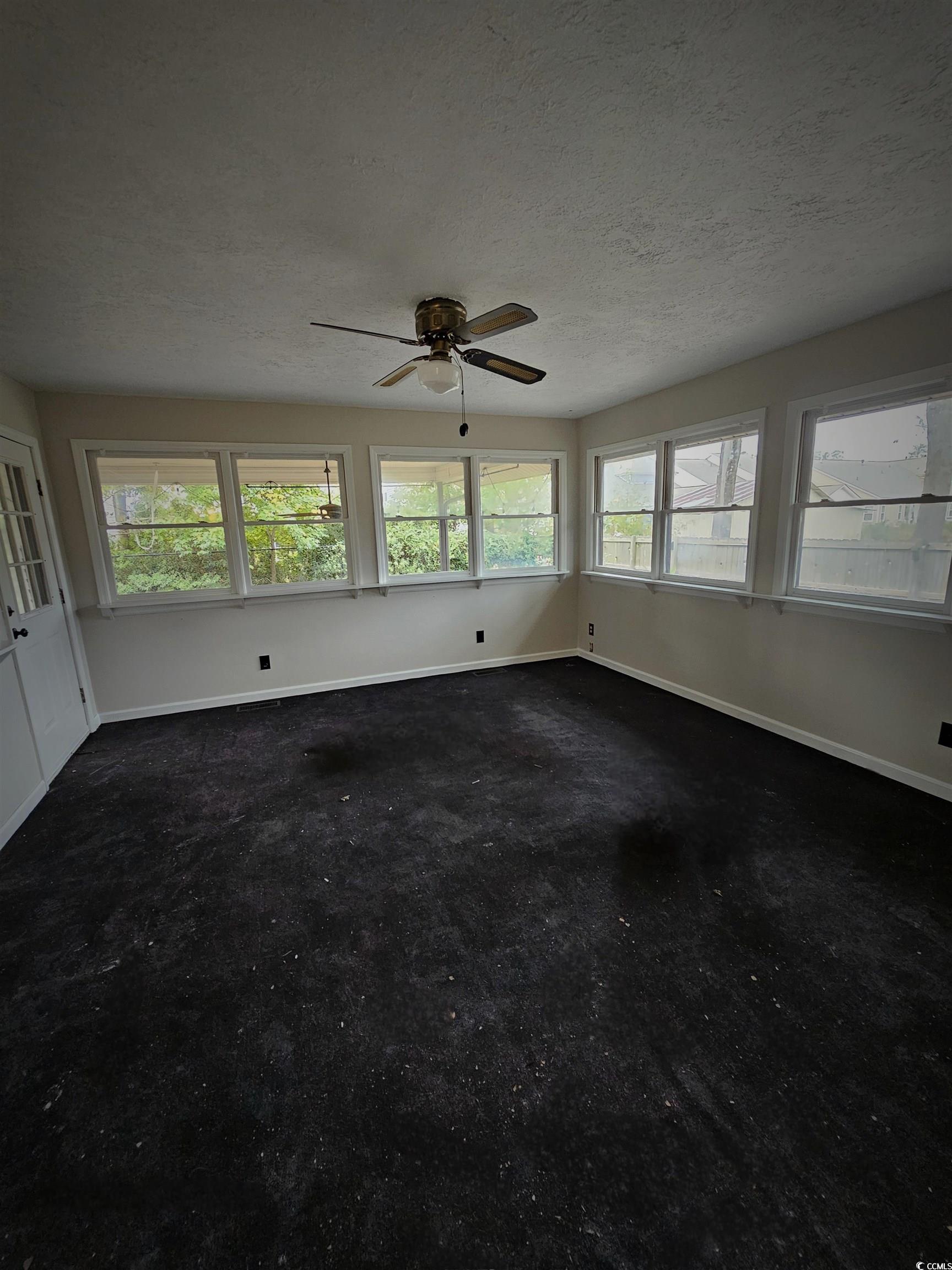 117 Partridge Berry Road Myrtle Beach, SC 29579 - Photo 16 of 33 Empty room with baseboards and a textured ceiling