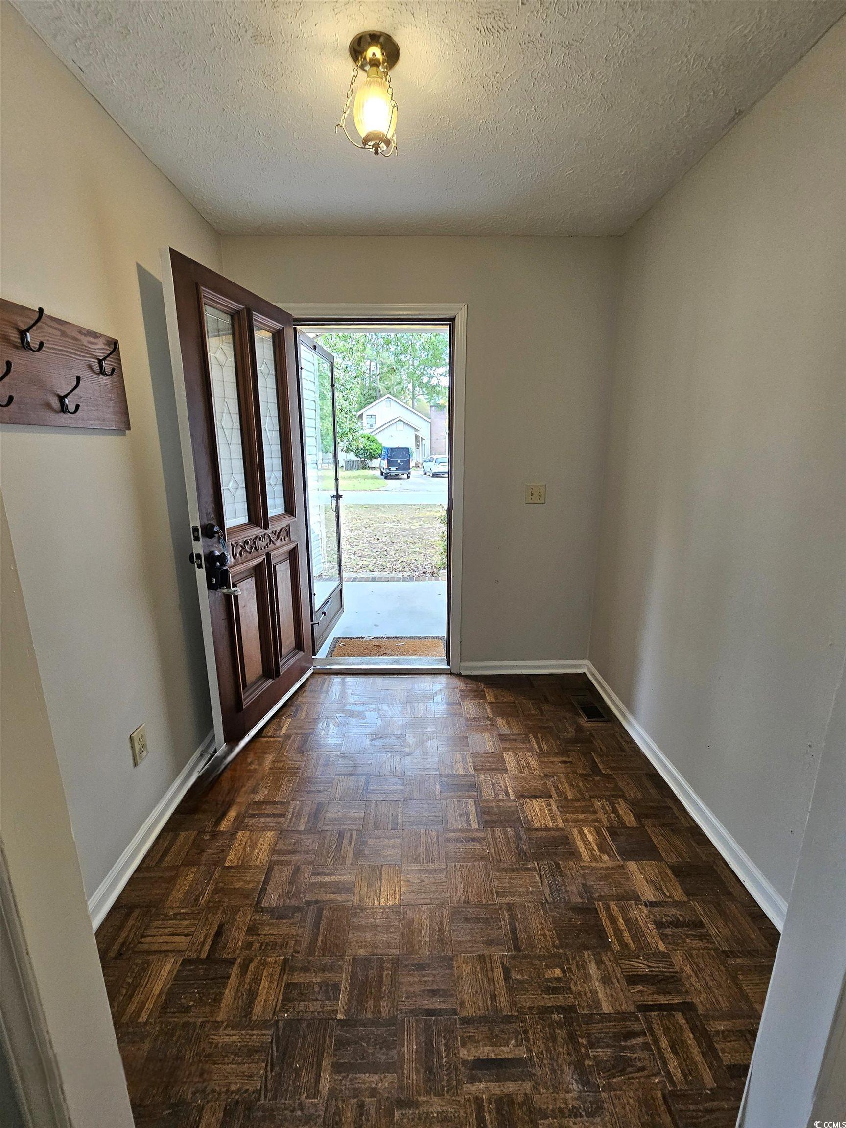 117 Partridge Berry Road Myrtle Beach, SC 29579 - Photo 2 of 33 Foyer with a textured ceiling and baseboards