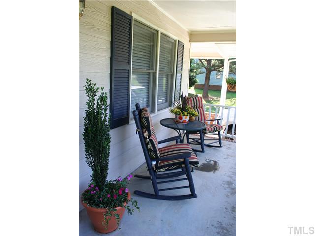 506 Parham Road Henderson, NC 27536 - Photo 3 of 12 a outdoor living space with furniture and a potted plants