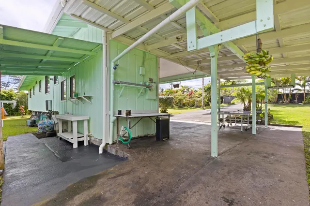 a view of a chairs and table in the patio