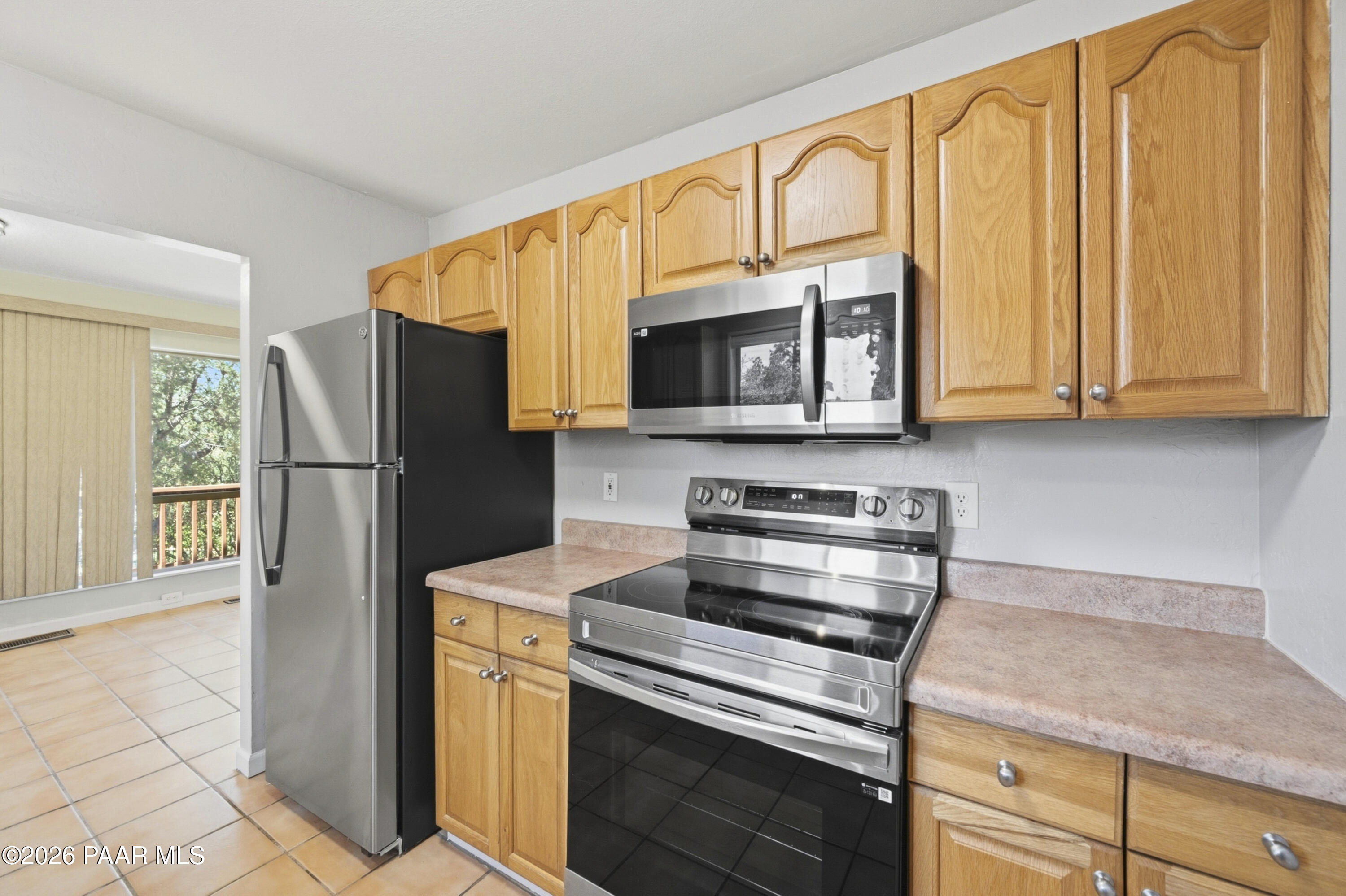 1775 Grandview Road Prescott, AZ 86305 - Photo 13 of 42 a kitchen with stainless steel appliances granite countertop a refrigerator stove and microwave