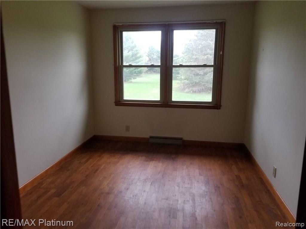 10091 Fenton Road Fenton, MI 48430 - Photo 12 of 13 Bedroom overlooking back yard
