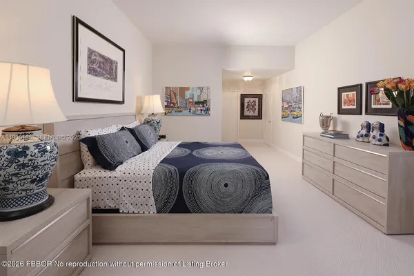 a living room with furniture and a bed