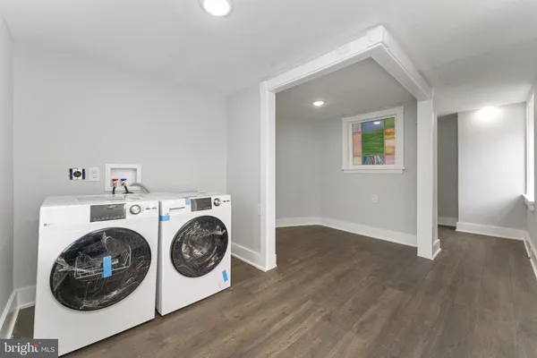 a view of storage and utility room with washer and dryer