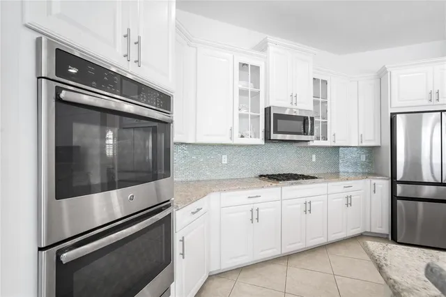 a living room with furniture and flat screen tv