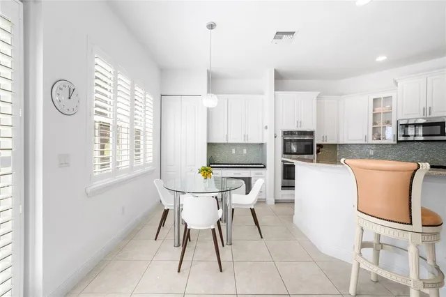 a view of a dining room with furniture and window