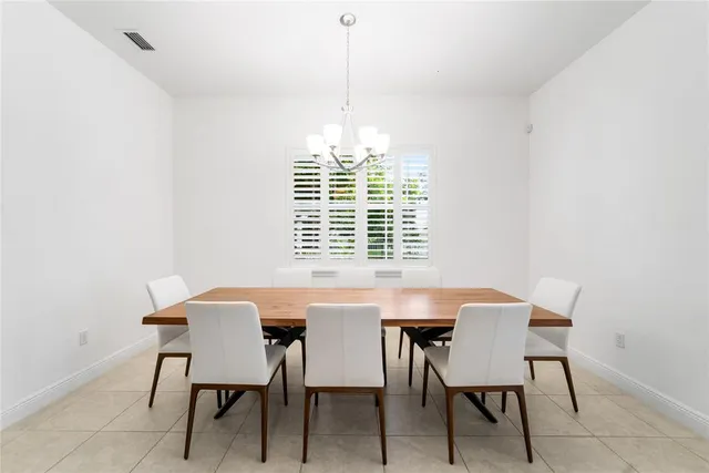 a spacious bathroom with a granite countertop tub sink and mirror