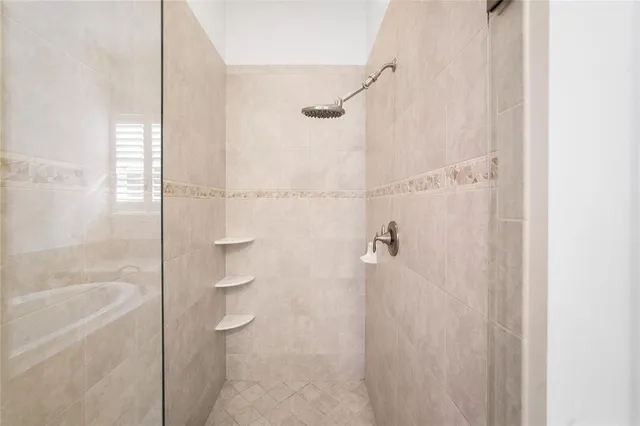 a front view of a house with swimming pool having outdoor seating