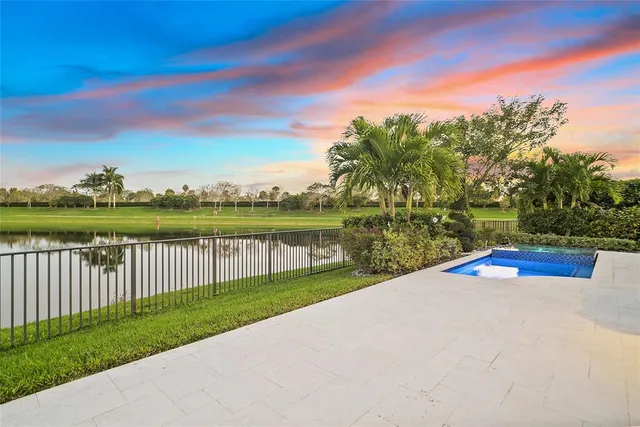 a living room with furniture gym equipment and a large window