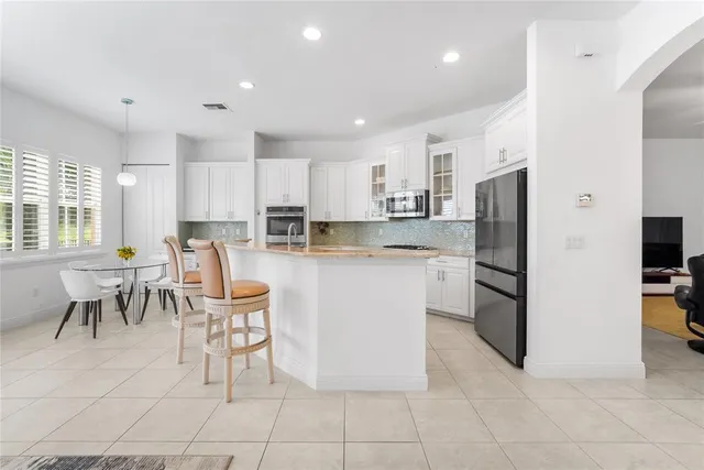an aerial view of a house with a lake view