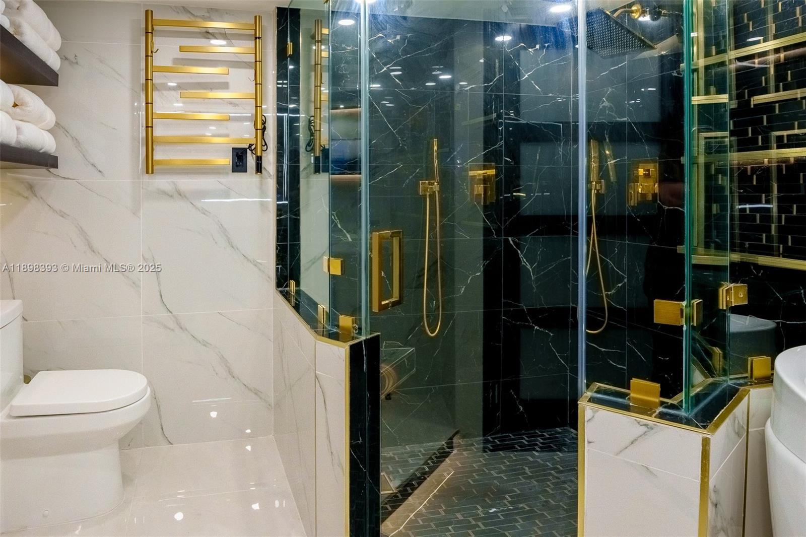 4000 Towerside Terrace, Unit 410 Miami, FL 33138 - Photo 12 of 74 a bathroom with a shower and toilet