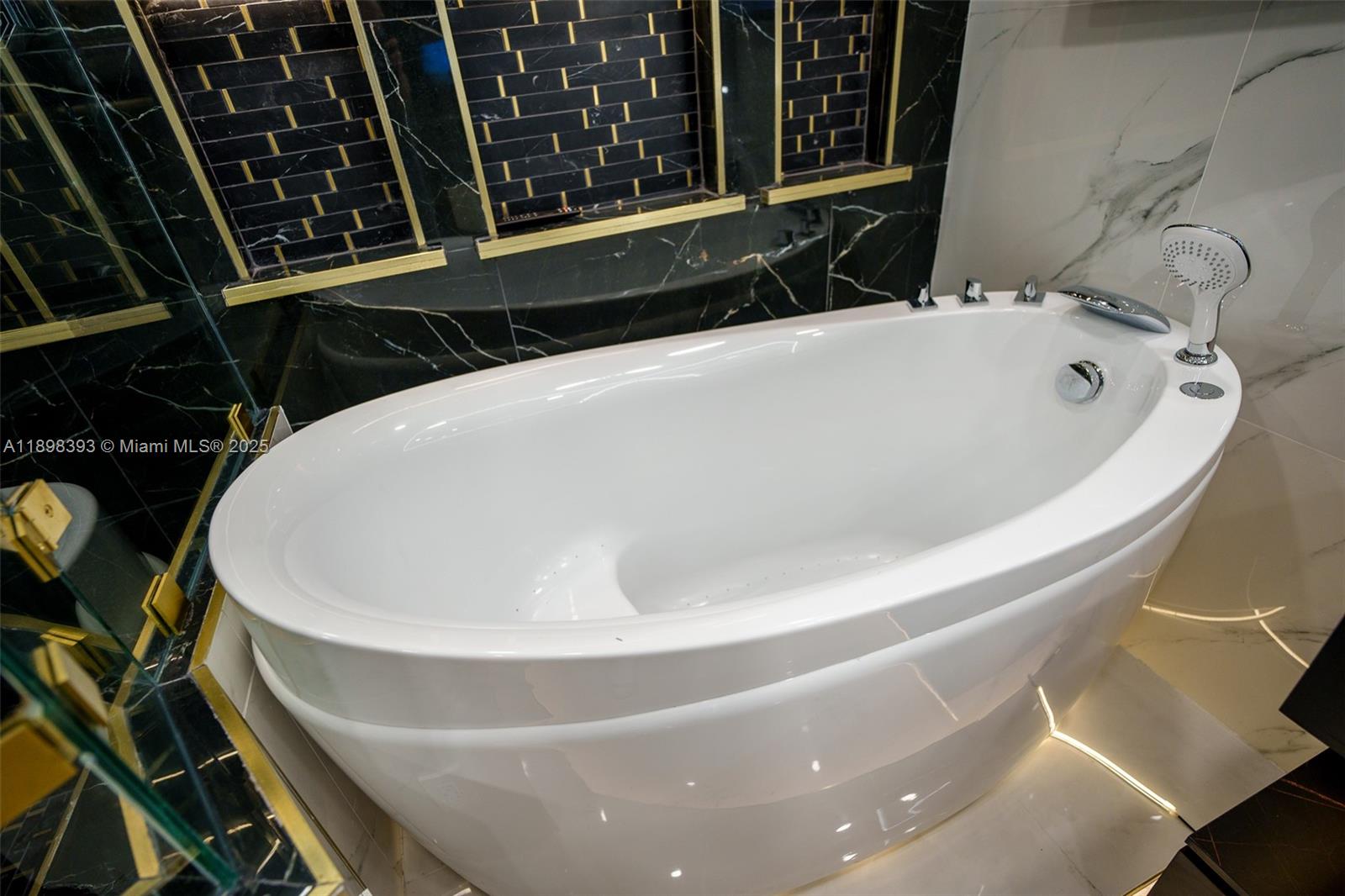 4000 Towerside Terrace, Unit 410 Miami, FL 33138 - Photo 14 of 74 a bath tub sitting in a bathroom