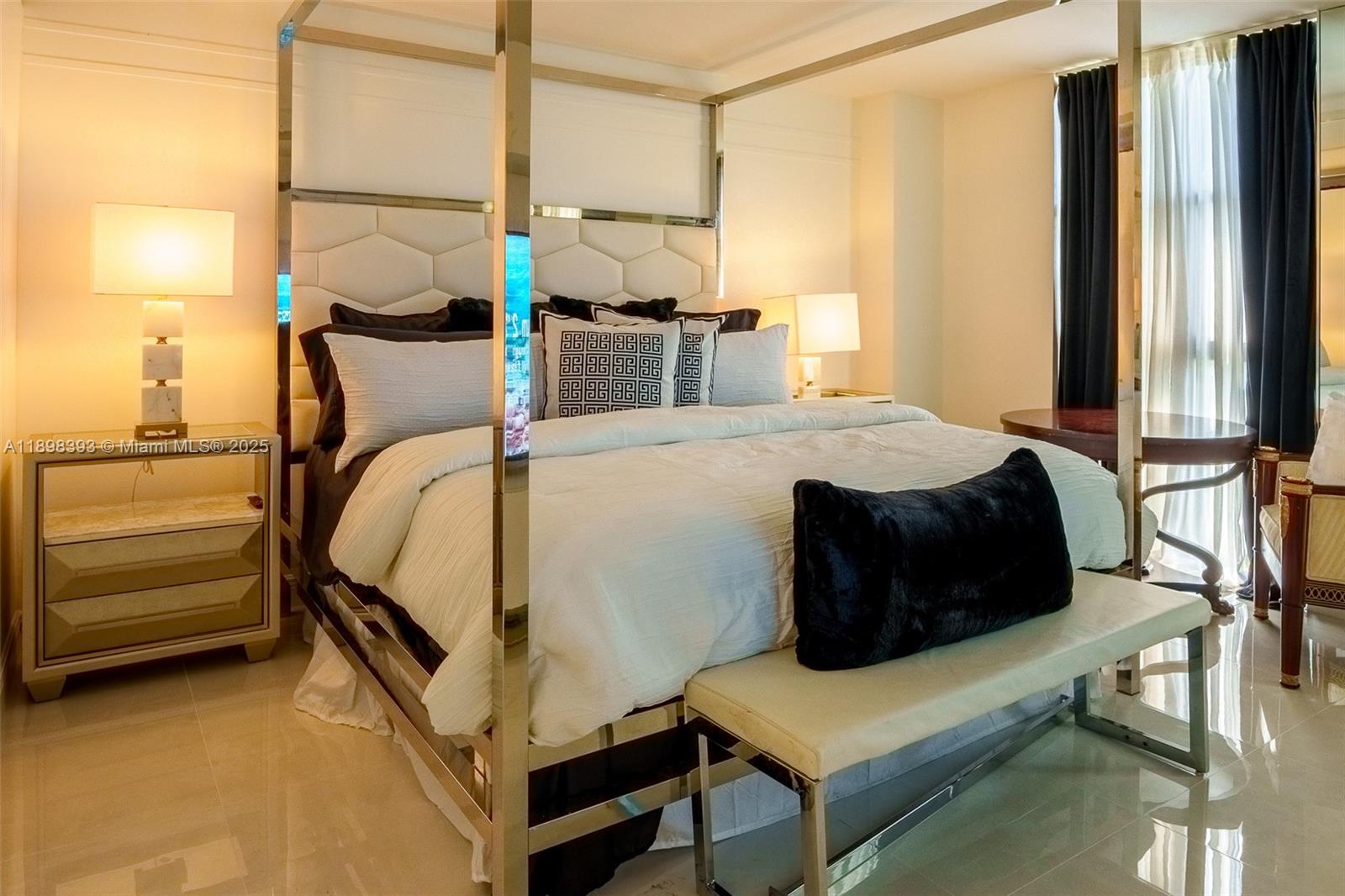 4000 Towerside Terrace, Unit 410 Miami, FL 33138 - Photo 21 of 74 a bedroom with a bed and wooden floor