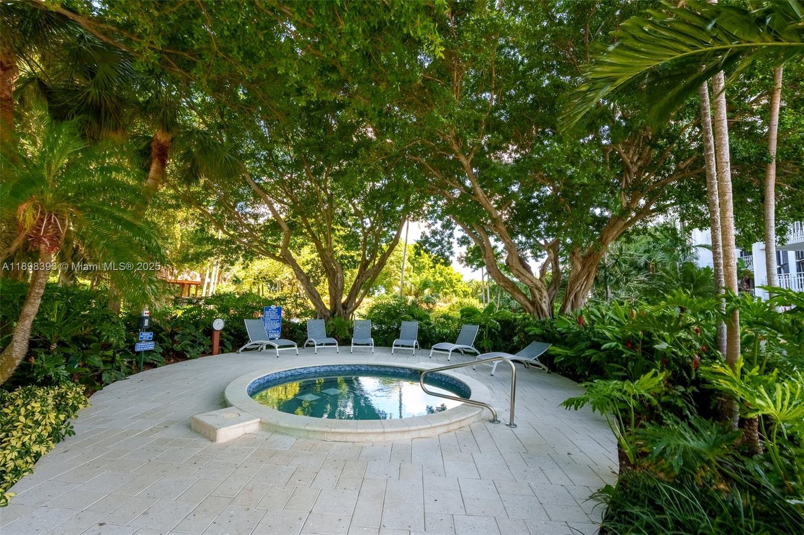 4000 Towerside Terrace, Unit 410 Miami, FL 33138 - Photo 38 of 74 a view of a swimming pool with a patio
