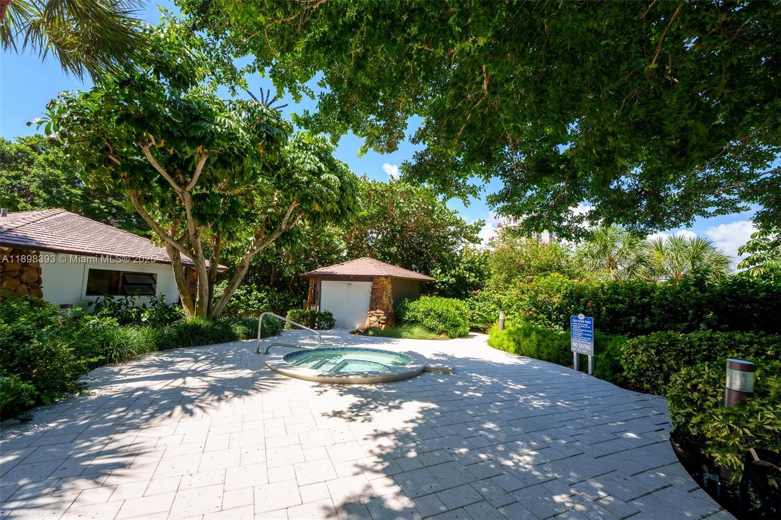 4000 Towerside Terrace, Unit 410 Miami, FL 33138 - Photo 39 of 74 a pathway of a house with a yard