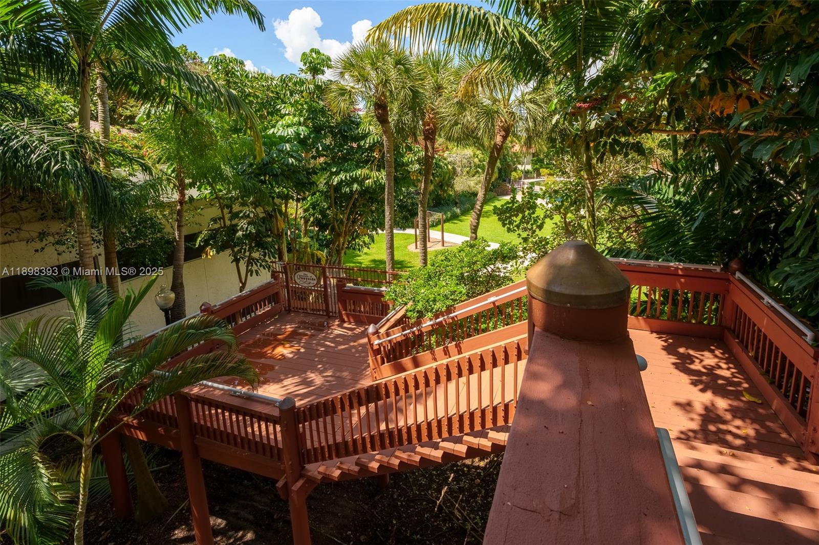 4000 Towerside Terrace, Unit 410 Miami, FL 33138 - Photo 45 of 74 a view of balcony with wooden floor and outdoor seating