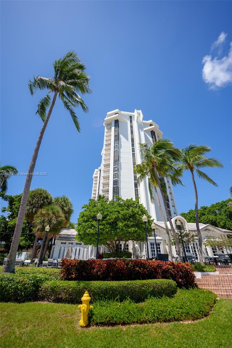 4000 Towerside Terrace, Unit 410 Miami, FL 33138 - Photo 54 of 74 a front view of a house with a yard