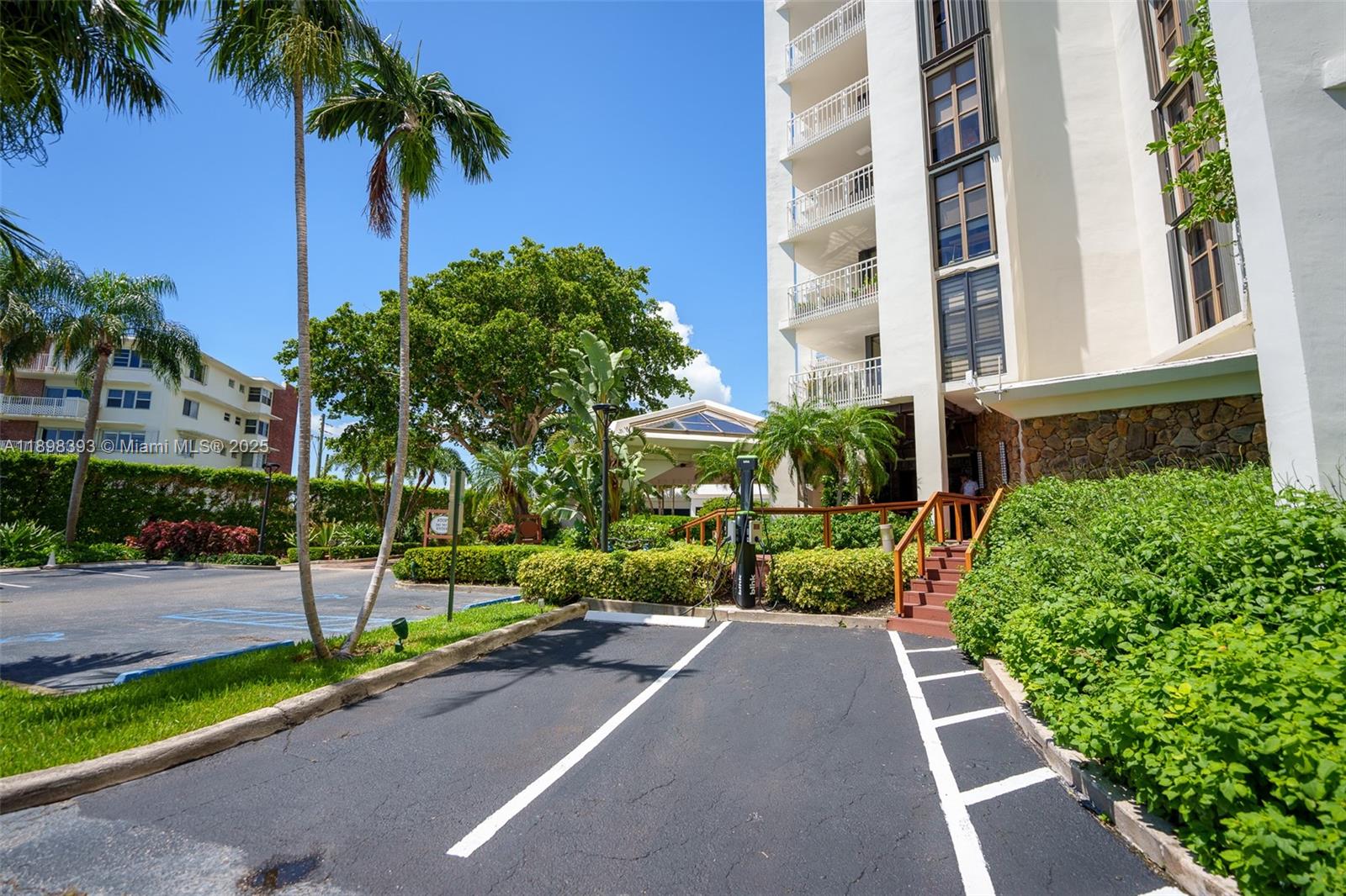 4000 Towerside Terrace, Unit 410 Miami, FL 33138 - Photo 57 of 74 a view of a garden with a building in the background