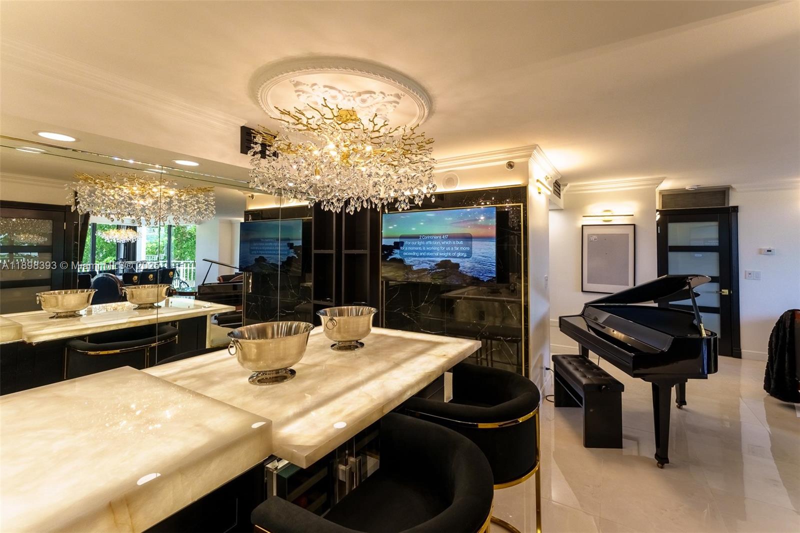 4000 Towerside Terrace, Unit 410 Miami, FL 33138 - Photo 6 of 74 a kitchen with a table and chairs in it