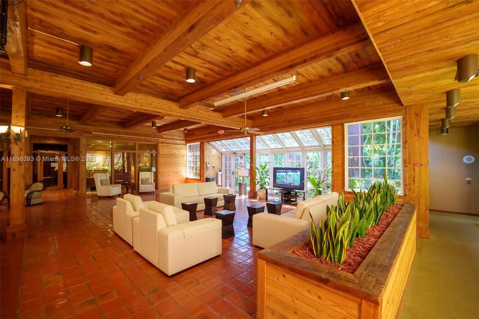 4000 Towerside Terrace, Unit 410 Miami, FL 33138 - Photo 65 of 74 a living room with furniture and a large window