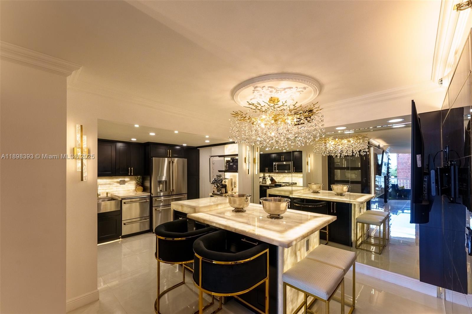 4000 Towerside Terrace, Unit 410 Miami, FL 33138 - Photo 7 of 74 a kitchen with a dining table and chairs