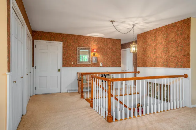 a view of a hallway with a window