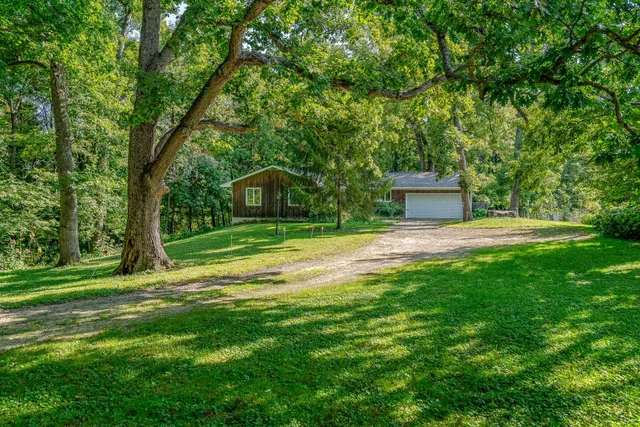 a house view with a sitting space and garden