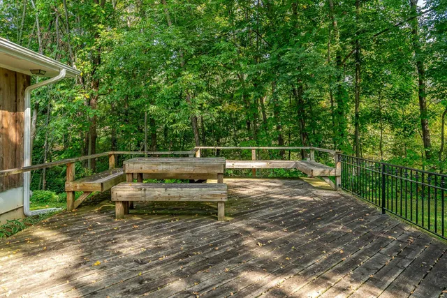 a view of a wooden deck with a bench