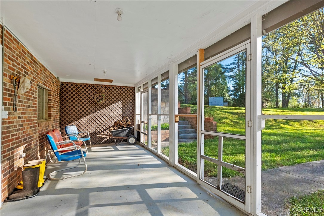 5290 Crumptown Road Farmville, VA 23901 - Photo 18 of 43 a view of sitting area in balcony with wooden fence